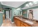 This bathroom has a double sink vanity with tile flooring and a walk in closet at 426 N Boyd St, Winter Garden, FL 34787