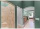 This bathroom features a tiled walk in shower, and tile flooring and is connected to the bedroom at 426 N Boyd St, Winter Garden, FL 34787