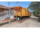 Bright yellow vintage train car with Chesie System logo as an attractive exhibit near a brick building at 426 N Boyd St, Winter Garden, FL 34787