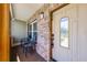 Inviting front porch with stone accents, seating, and a secure door, offering a welcoming entrance to the home at 426 N Boyd St, Winter Garden, FL 34787