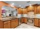 This kitchen boasts granite counters, tile backsplash, and views into the dining and living areas at 426 N Boyd St, Winter Garden, FL 34787