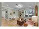 Inviting living room features hardwood floors, soft green walls, and a comfortable seating area at 426 N Boyd St, Winter Garden, FL 34787