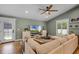 Comfortable living room featuring tile floors, a large sectional couch, and a TV at 426 N Boyd St, Winter Garden, FL 34787