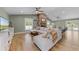 Spacious living room featuring tile floors, a stone fireplace, comfortable seating, and a TV at 426 N Boyd St, Winter Garden, FL 34787