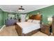 Spacious main bedroom with hardwood floors, stylish furniture, and ample natural light at 426 N Boyd St, Winter Garden, FL 34787