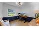 Home office with custom trim, hardwood floors, desk, and outside view from the window at 426 N Boyd St, Winter Garden, FL 34787