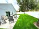 Backyard with patio seating and new lawn at 4339 Northern Dancer Way, Orlando, FL 32826