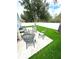 Backyard with outdoor seating, patio and manicured lawn at 4339 Northern Dancer Way, Orlando, FL 32826