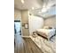This bedroom features wood-look floors, an area rug, and cozy décor at 4339 Northern Dancer Way, Orlando, FL 32826