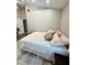 Minimalist bedroom featuring a comfortable bed, soft rug, and neutral colors at 4339 Northern Dancer Way, Orlando, FL 32826