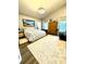 Bright bedroom with a decorative rug, ample natural light, and neutral tones at 4339 Northern Dancer Way, Orlando, FL 32826