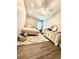 Cozy bedroom with wood floors, soft rug, white dresser, and plenty of natural light at 4339 Northern Dancer Way, Orlando, FL 32826