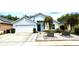 Charming one-story home with a well-manicured lawn and eye-catching landscaping at 4339 Northern Dancer Way, Orlando, FL 32826