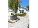 Charming home featuring a beautifully landscaped front yard with white rock features and unique planters at 4339 Northern Dancer Way, Orlando, FL 32826