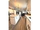 Contemporary kitchen featuring a central island, stainless steel appliances, and open-concept design at 4339 Northern Dancer Way, Orlando, FL 32826