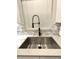 Modern kitchen sink with a stylish faucet and window view at 4339 Northern Dancer Way, Orlando, FL 32826