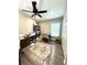 Comfortable office with ceiling fan, rug, modern shelving, and storage at 4339 Northern Dancer Way, Orlando, FL 32826