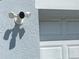 Exterior security camera and motion sensor lights for enhanced home security at 4339 Northern Dancer Way, Orlando, FL 32826