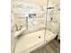Luxurious walk-in shower featuring marble tile, rain showerhead, and built-in shelves at 4339 Northern Dancer Way, Orlando, FL 32826