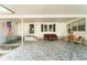 Spacious covered carport with stylish outdoor furniture, creating an ideal lounge area at 44 Florence Blvd, Debary, FL 32713