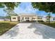 Charming single-story home with a covered carport and a well-maintained front yard at 44 Florence Blvd, Debary, FL 32713