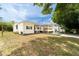 Attractive home with a covered carport, set in a neatly kept yard at 44 Florence Blvd, Debary, FL 32713
