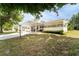 Attractive home with a covered carport, showcasing neat landscaping and a welcoming atmosphere at 44 Florence Blvd, Debary, FL 32713
