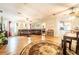 Features an open-concept living space with a leather sectional, seamlessly integrated with the dining and kitchen area at 44 Florence Blvd, Debary, FL 32713