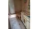 Bathroom needing renovation, with pink fixtures, tiled walls and floor, and sink at 461 Marigold Rd, Casselberry, FL 32707