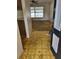 Entryway with outdated flooring and decor, highlighting the need for renovations and updates at 461 Marigold Rd, Casselberry, FL 32707