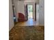 Entryway with outdated flooring and decor, highlighting the need for renovations and updates at 461 Marigold Rd, Casselberry, FL 32707