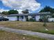 Charming single story house with a front yard and attached garage at 461 Marigold Rd, Casselberry, FL 32707