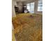 Living room with an old carpet that needs replacement, filled with clutter and items to be cleared out at 461 Marigold Rd, Casselberry, FL 32707