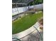 Outdoor pool requiring maintenance, surrounded by a white fence and greenery at 461 Marigold Rd, Casselberry, FL 32707