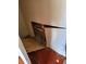 Damaged wall with exposed pipes and missing drywall, revealing repair needs in this fixer-upper property at 461 Marigold Rd, Casselberry, FL 32707