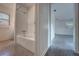 A bathroom with a bathtub and a shower with tiled walls and flooring at 508 W Hogle Ave, Deland, FL 32720