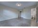 Spacious bedroom with large window, carpeted floors, and closet at 508 W Hogle Ave, Deland, FL 32720