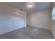 Bedroom featuring built-in closet space, a large window, neutral paint, and great natural light at 508 W Hogle Ave, Deland, FL 32720