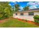 Exterior view highlighting the well-maintained landscaping and the home's architectural details at 508 W Hogle Ave, Deland, FL 32720