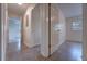 Hallway featuring multiple doors, leading to various rooms, with neutral paint throughout at 508 W Hogle Ave, Deland, FL 32720
