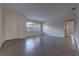 Bright, freshly painted living room with a clean floor, and neutral trim at 508 W Hogle Ave, Deland, FL 32720