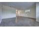 Open living room with multiple windows and neutral flooring at 508 W Hogle Ave, Deland, FL 32720