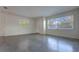 Bright, freshly painted living room with a clean floor, large windows and natural light at 508 W Hogle Ave, Deland, FL 32720
