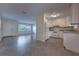 Bright living room with lots of natural light coming from the large windows into the combined kitchen space at 508 W Hogle Ave, Deland, FL 32720