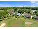 Beautiful aerial view of a golf course community with mature trees and well-maintained lawns at 5097 Nw 19Th Pl, Ocala, FL 34482