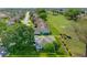Aerial view of a home with solar panels backing onto a lush golf course in a tranquil neighborhood at 5097 Nw 19Th Pl, Ocala, FL 34482