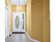 Welcoming entryway with decorative front door, neutral walls, and light tile flooring at 5097 Nw 19Th Pl, Ocala, FL 34482