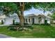 Charming single-story home with mature trees and landscaped front yard at 5097 Nw 19Th Pl, Ocala, FL 34482