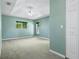 Spacious main bedroom with carpet, ceiling fan, and lots of natural light at 5097 Nw 19Th Pl, Ocala, FL 34482