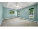 Spacious main bedroom features a trey ceiling, ceiling fan and lots of windows at 5097 Nw 19Th Pl, Ocala, FL 34482